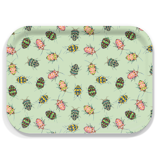 A rectangular tray with rounded corners, featuring a light green background covered in a repeating pattern of colorful beetle illustrations.